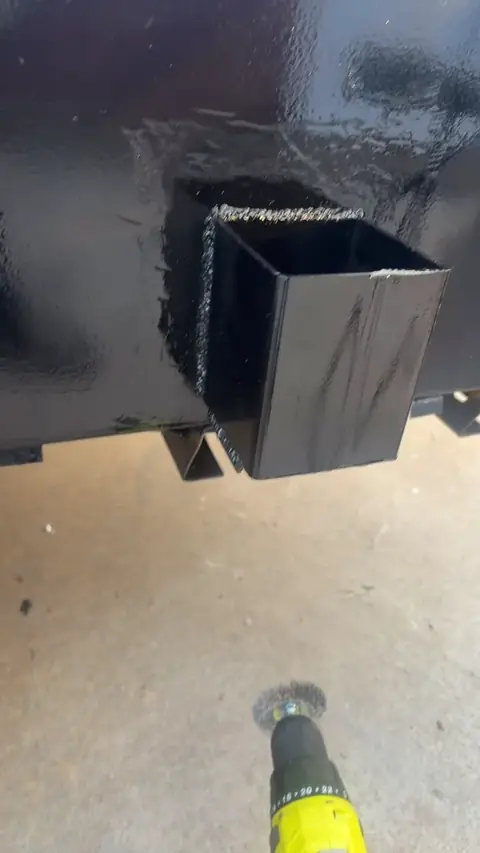 Custom pockets attached to a black utility trailer